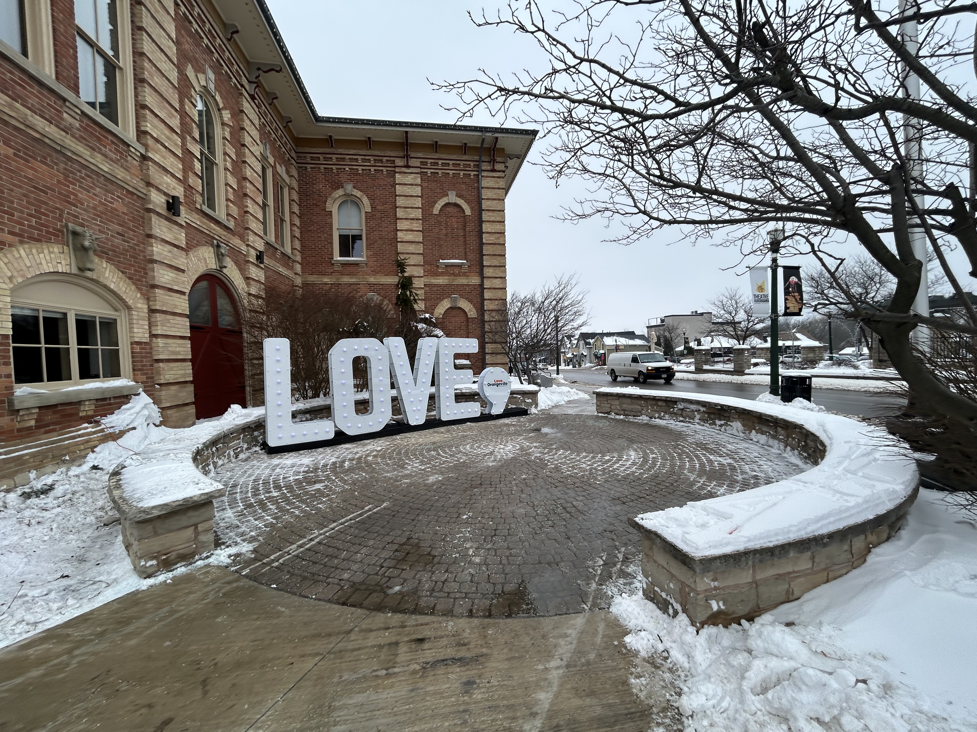  A picture of a love sign outside of a historic brick building